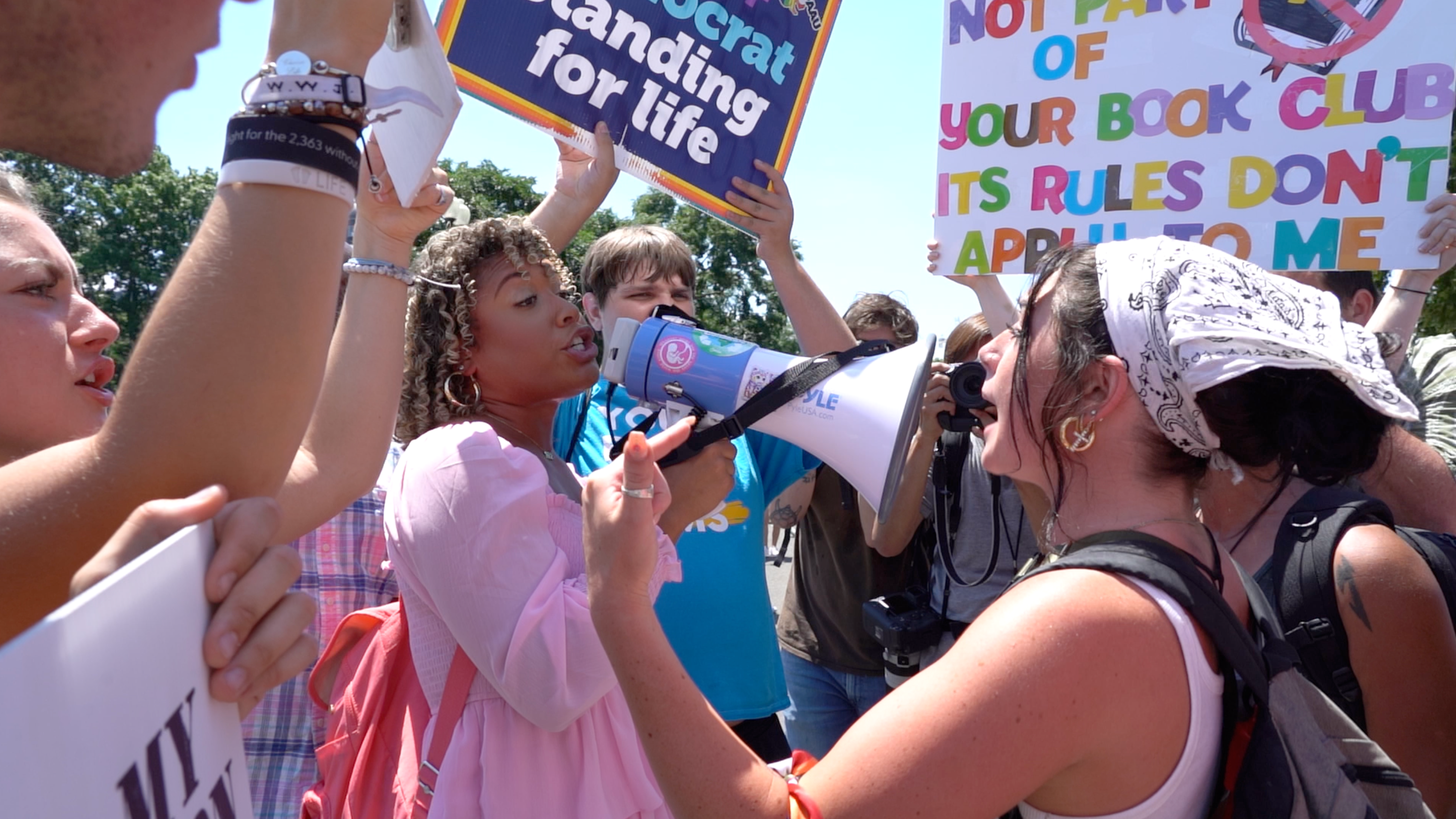 Pro-choice and anti-abortion protesters clash outside the Supreme Court in Washington DC following the fall of Roe v Wade